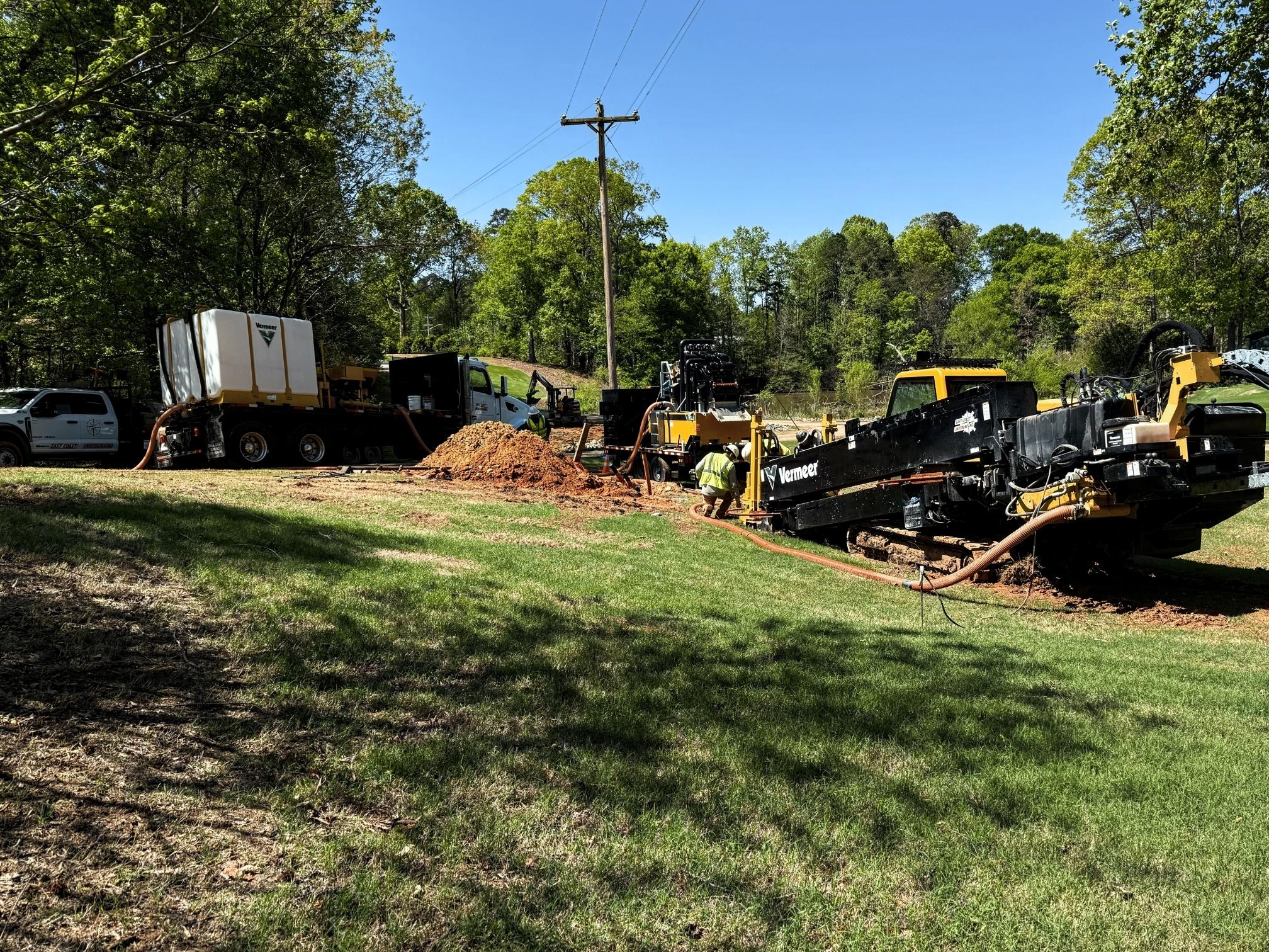 Vermeer directional drill crew working on a grassy jobsite