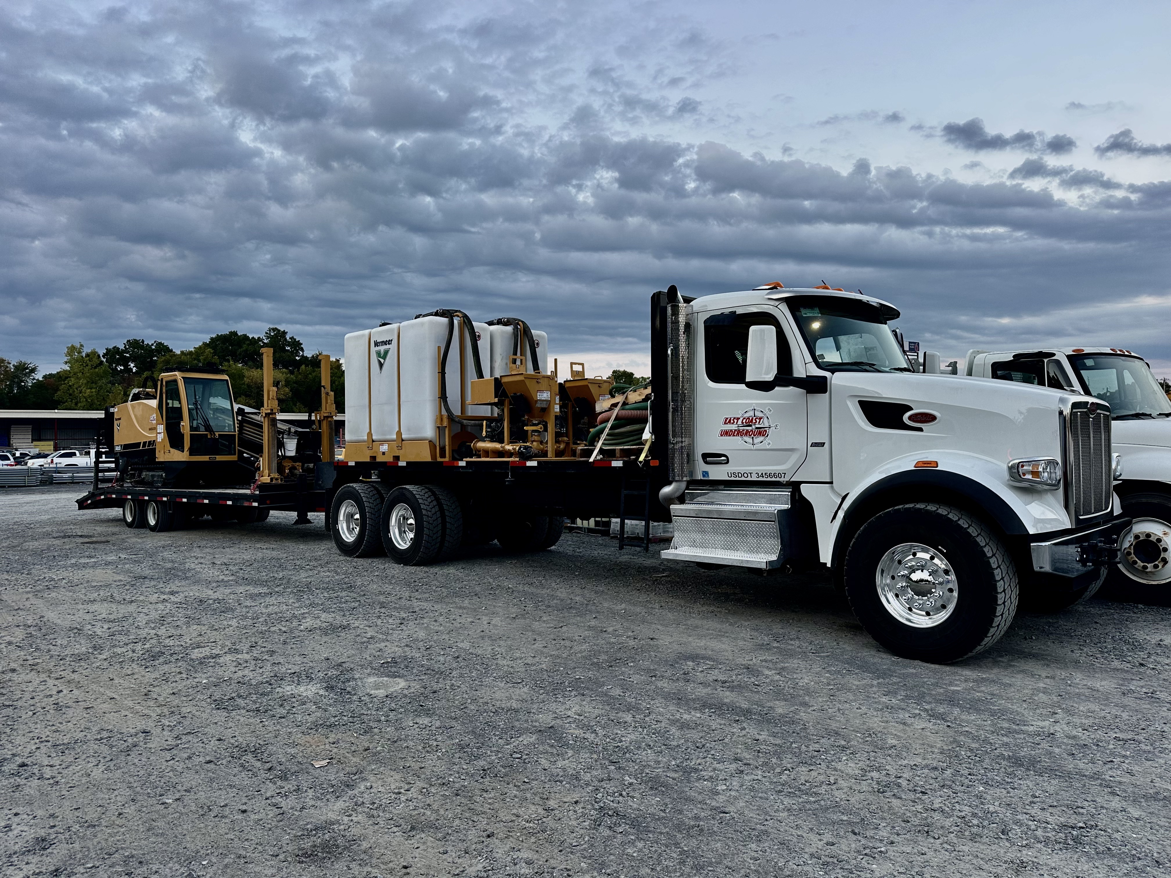 East Coast Underground truck and Vermeer equipment on a flatbed trailer for Hwy 548 6 inch Feeder Main project